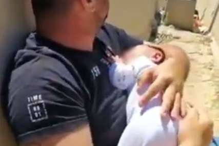 "Stradanje na obje strane, vlasti da prekinu sukobe"   Snimak oca sa bebom u naručju tokom raketiranja pokrenuo raspravu (VIDEO)