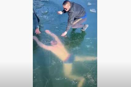 PANIČNO TRAŽIO IZLAZ Sportistu spašavali nakon što je zaronio u zaleđeno jezero (VIDEO)