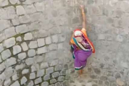 POTRESAN PRIZOR Žena bez užeta i pojasa silazi i penje se uz bunar kako bi došla do vode (VIDEO)