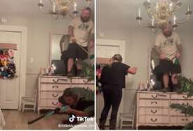 HAOS U KUĆI Žena pokušava istjerati pacova, a suprug vrišti na komodi s metlom u ruci (VIDEO)