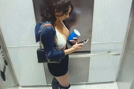 Žena sa ukradenom robom u liftu