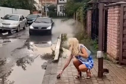 Dosjetila se genijalnog trika: Nagovijestila vozaču kako će proći ako je zapljusne vodom sa ulice (VIDEO)