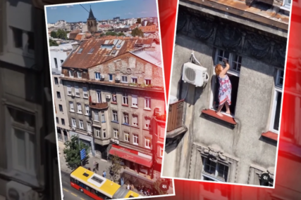 "Šta je vrednije,  ŽIVOT ILI PROZOR" Ljudi šokirani snimcima sugrađanki koje peru stakla dok stoje na simsu zgrade (VIDEO)