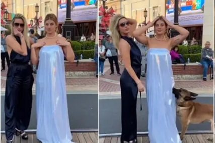 (VIDEO) Nestašni pas postao hit na internetu: Djevojci nasred ulice skinuo haljinu, pa je odnio svom vlasniku
