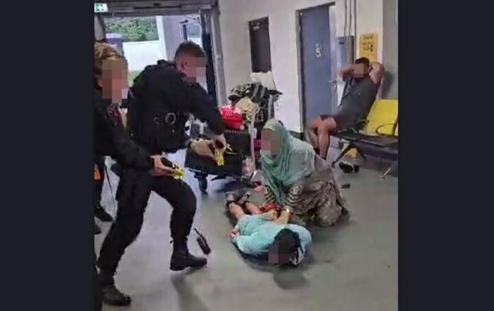Policajac šutira glavu uhapšenog muškarca 