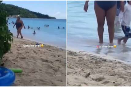 (VIDEO) "SKIDAM JOJ KAPU, NA ŠTIKLAMA PO PIJESKU" Ova žena se na plaži pojavila u neobičnom izdanju, pljušte komentari