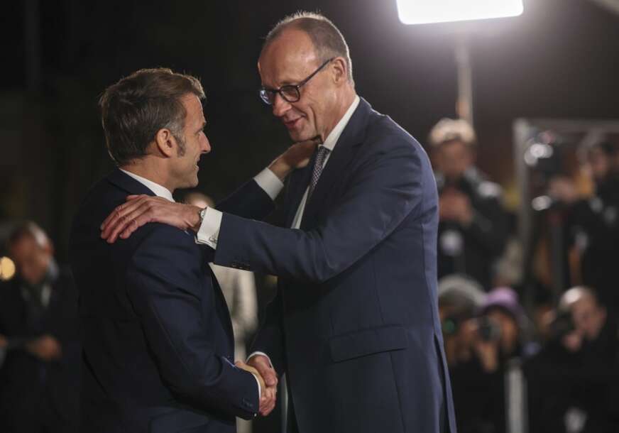 Emanuel Makron i Fridrih Merc