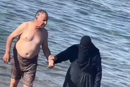 (VIDEO) "On šeta golog stomaka, dok ona NE MOŽE DA DIŠE" Buknula žestoka rasprava na snimak muslimanskog para na plaži